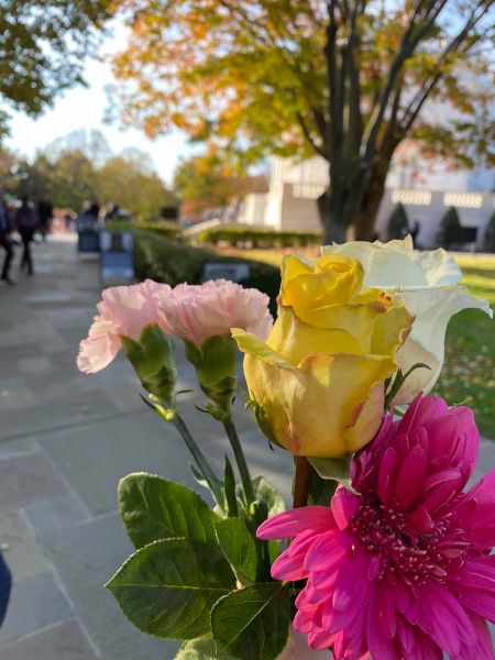 History Teacher Dave, holds his flowers up as he prepares to lay them on the Tomb of the Unknown Soldier Plaza.